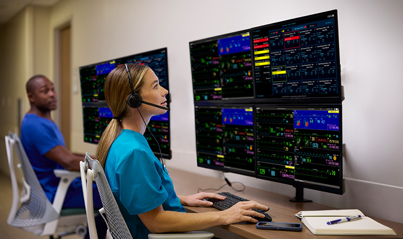 Physicians looking at an integrated patient view on a dual monitor